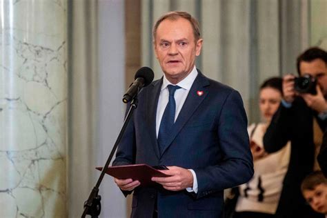 New Polish Prime Minister Donald Tusk is sworn in with his government